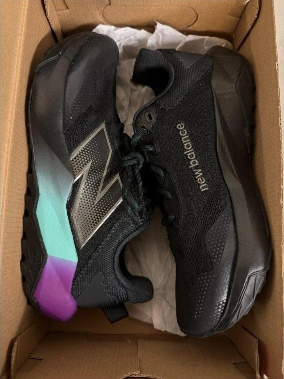 New Balance Women's Black Athletic Shoes with Teal and Purple Heel Accents